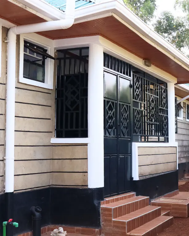 Tiled steps up to a bungalow's veranda door